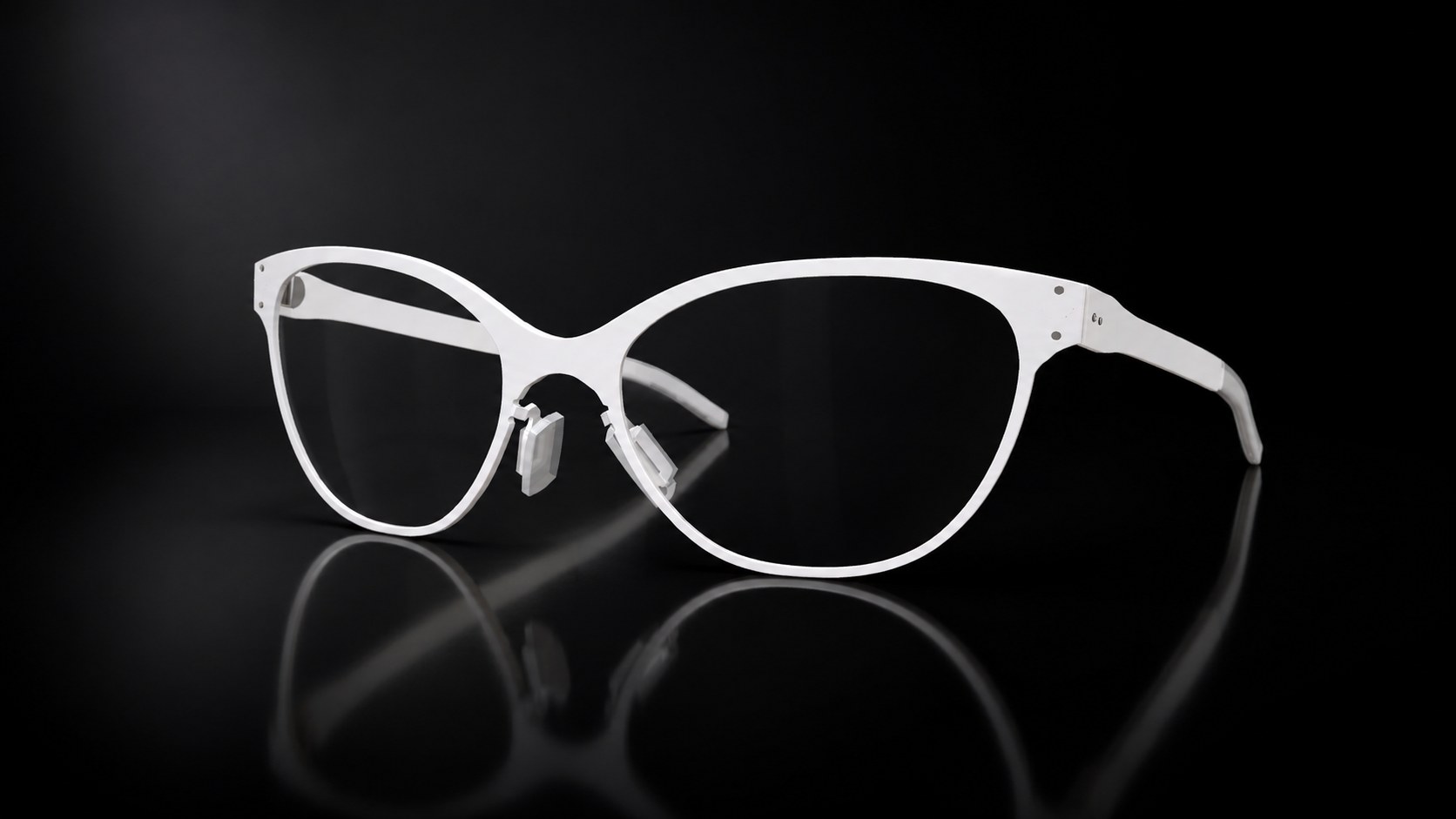 White titanium Pine frame on a black reflective surface