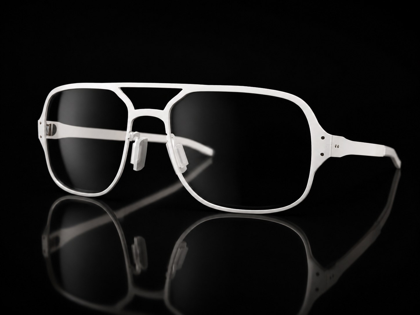 White titanium Airbridge frame on a black reflective surface